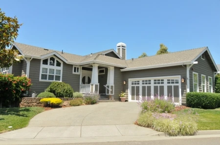 Dark gray home with white trim  