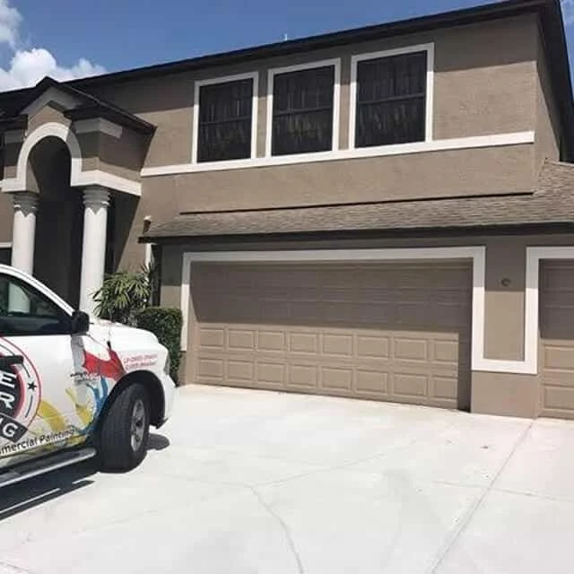 Brown and white home after exterior painting from Five Star Painting