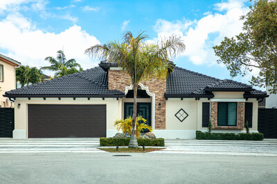 Modern Florida home exterior with palm trees.