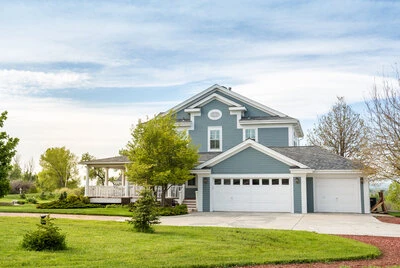 Exterior of a home with a three car garage.