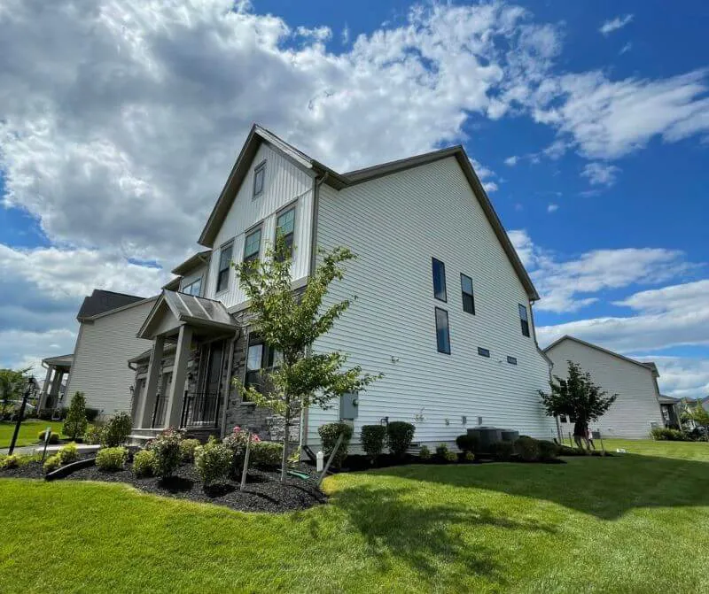 Exterior of house after pressure washing from Five Star Painting.