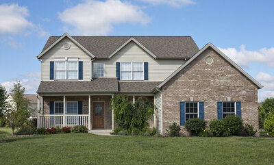 Two story house with tan, gray, and blue exterior paint