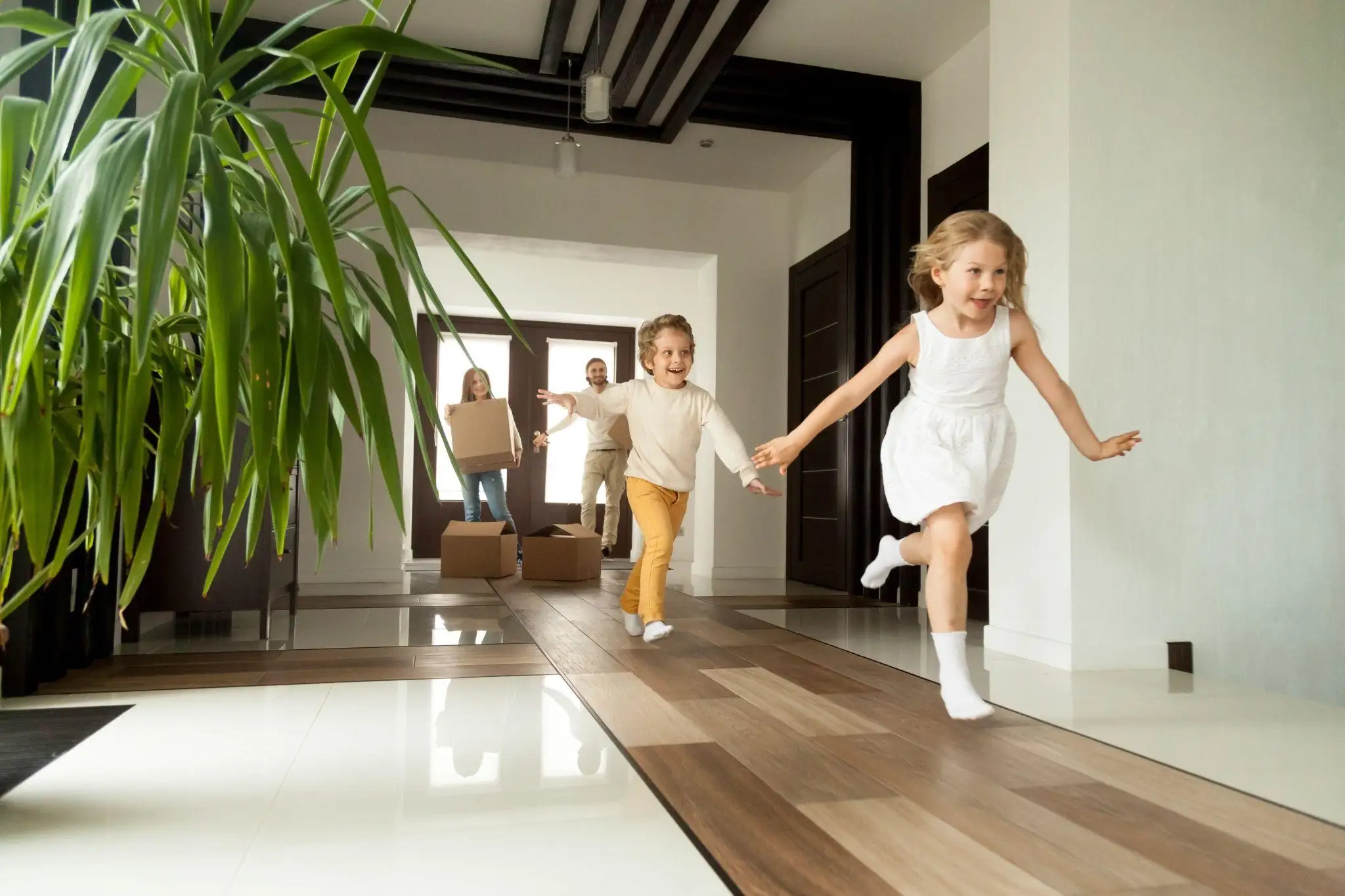 Children running through a hallway.