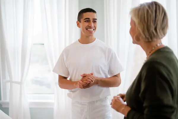 A PTP employee speaking with a female customer.