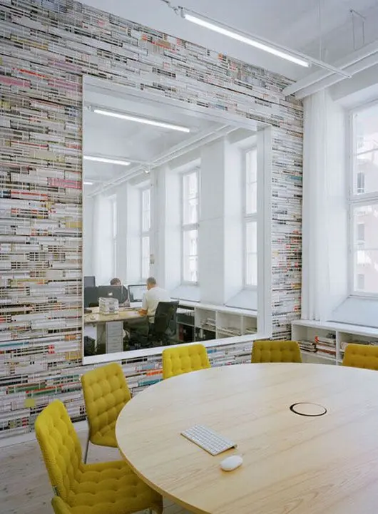 Conference room with round table and yellow chairs