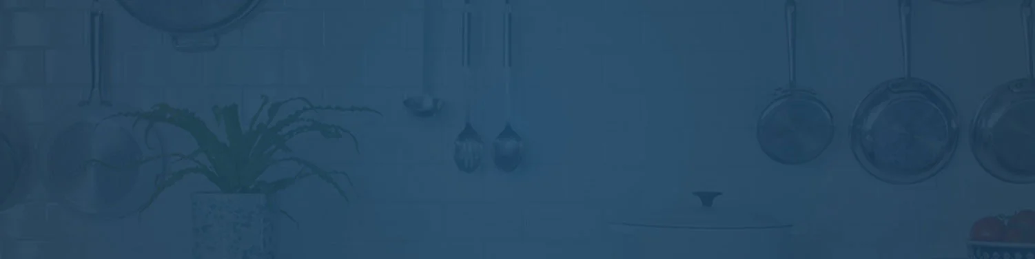 Blue banner with pots and pans hanging in kitchen.