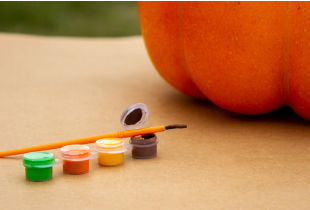 A pumpkin with painting materials