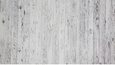 Photo of a wooden platform painted white.