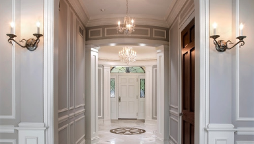 Grey-painted entrance hall with marble floors