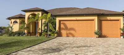 A home with stucco siding that has recently been painted.