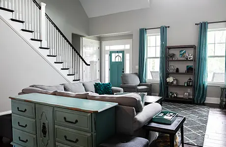 a living room with staircase