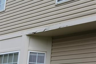 Rotten wooden trim on a house
