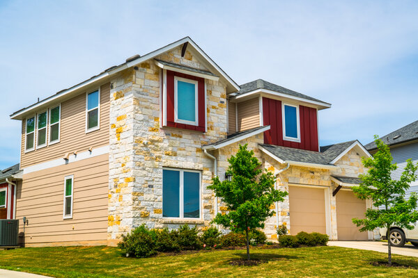 Home with modern tan, red, and white exterior paint by Five Star Painting of Dallas.