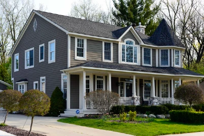 Stunning house exterior painted grey with white trim