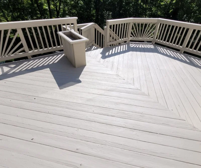 Large off-white patio after deck painting service from Five Star Painting.