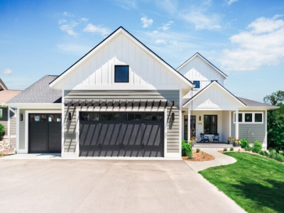 Modern home with black garage doors.