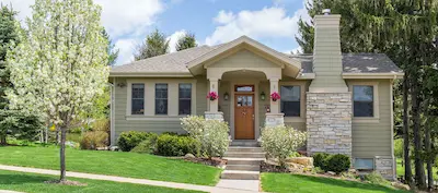 A stone front home on a hill