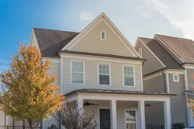 Gorgeous up-scale cottage with light gray and white exterior paint.