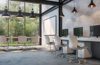 A large interior office space with a conference table, chairs, filing cabinets and computers painted by Five Star Painting of Frisco