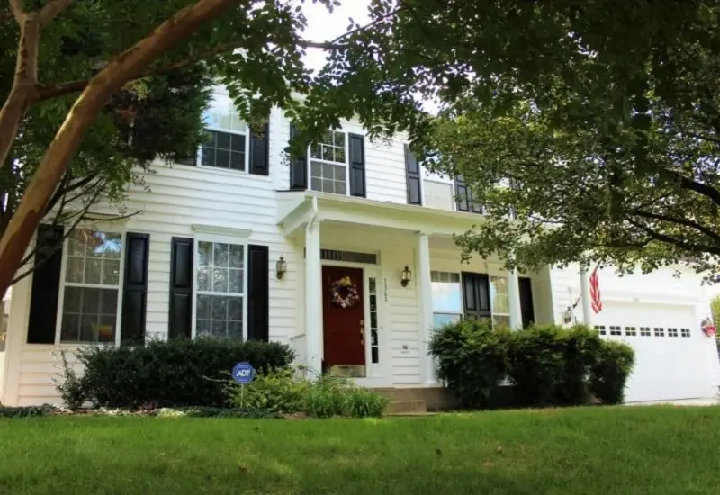 white two story colonial front facade