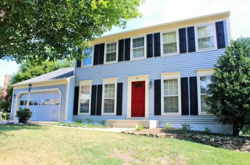 blue two-story colonial house