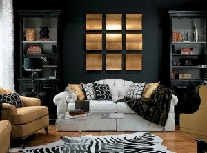 Living room painted with highlight black wall and white couch with black pillows
