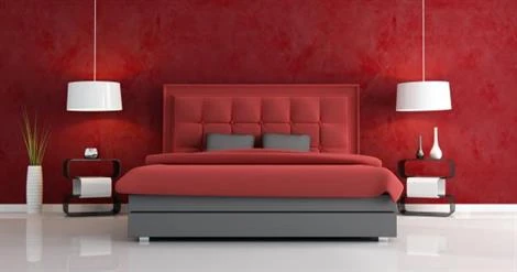 red bedroom paint with red highlight wall and red bed with similar color bedding